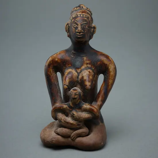 A Sawankhalok stoneware figure (tukatha),